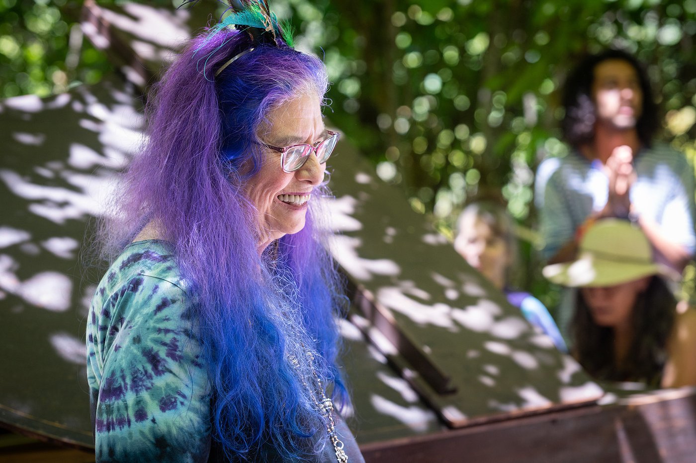 A radiant smile in the dappled light